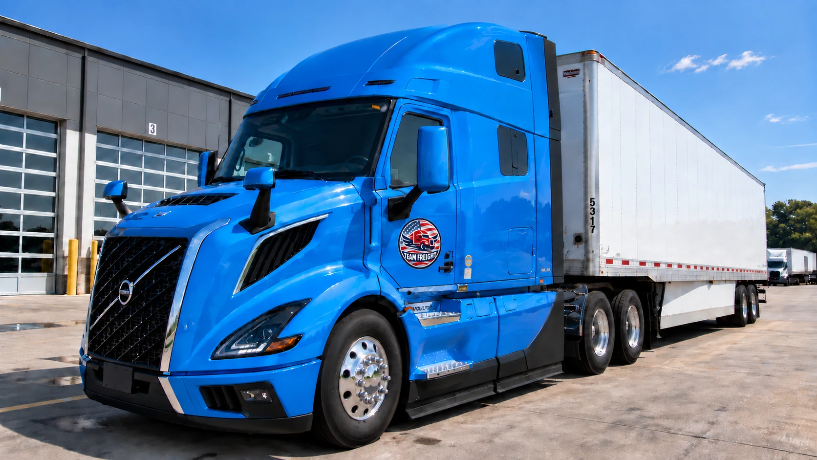 Home Team Freight semi truck with white trailer at a freight facility
